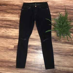 Dark wash denim with knee cutouts